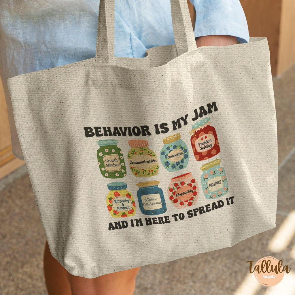 A canvas tote bag, with cute jam jars design, written "Behavior is my jam", featuring descriptive words related to behavior analyst, ABA theray, Beahavioral therapist