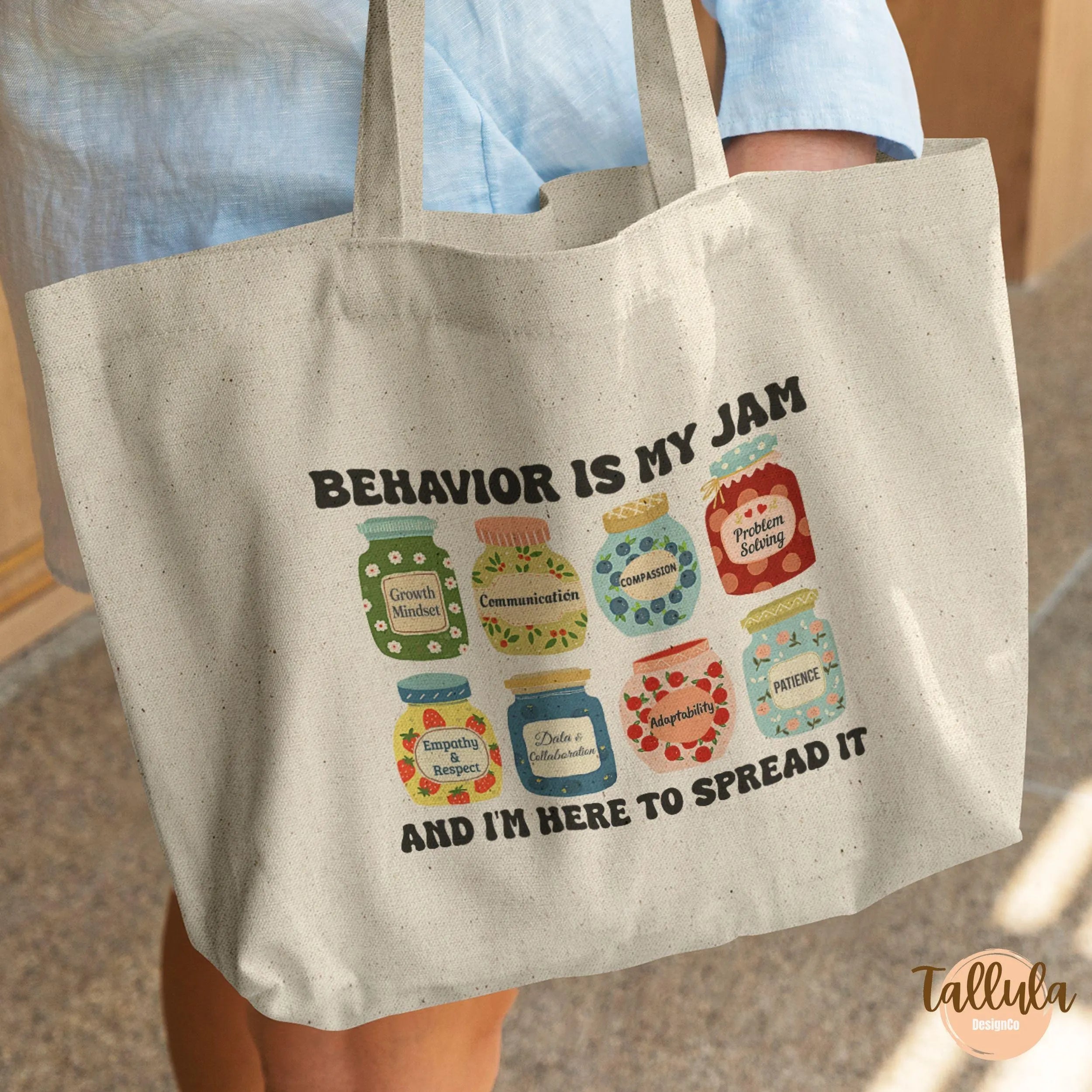 A canvas tote bag, with cute jam jars design, written "Behavior is my jam", featuring descriptive words related to behavior analyst, ABA theray, Beahavioral therapist